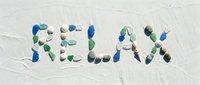 Word RELAX spelled with colorful sea glass and pebbles on white sand beach, evoking summer vacation, mindfulness, and coastal tranquility.