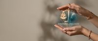 Hands holding glowing sphere with wellness icon and text, representing emotional health, mental care, and holistic wellbeing support for therapeutic and healthcare concepts.