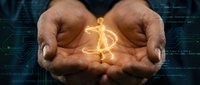 Businessman hands protecting glowing golden dollar sign symbol representing financial security, investment protection and wealth management concepts.
