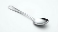 Stainless steel tablespoon with elegant curved handle isolated on white background for kitchen utensil designs and culinary presentations.