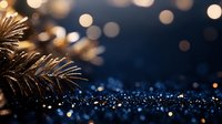 Golden pine branch with sparkling blue glitter and warm bokeh lights creating festive holiday atmosphere for seasonal decorations and celebrations.