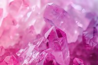 Pink crystal formations with geometric shapes and facets in macro view, natural mineral structure with light reflections creating dreamy ethereal atmosphere.