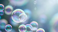 Floating soap bubbles with rainbow reflections against soft blurred background creating dreamy atmosphere for relaxation and childhood memories concepts.