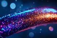 Magical glowing wave of orange and blue sparkles on dark background with bokeh effect, abstract light trail with shimmering particles flowing in space.