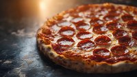 Fresh pepperoni pizza with melted cheese and crispy crust on dark rustic background, dramatic lighting creates appetizing mood for menu or advertising.