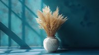 Dried pampas grass arrangement in round white ceramic vase against turquoise wall with dramatic window shadow creating minimalist composition.