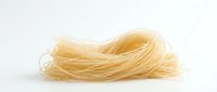Uncooked spaghetti pasta isolated on white background, ready for cooking or food design projects.