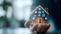 Digital smart home hologram with connected IoT icons floating above palm shows modern home automation and wireless technology integration for property control.