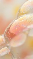 Soft pastel soap bubbles with water droplets floating in dreamy bokeh background for relaxation and wellness concepts.