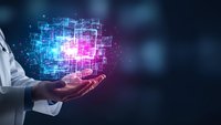 Professional in white coat holding glowing digital network hologram with connected nodes and data visualization for technology and innovation concepts.