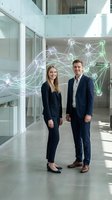Business professionals with digital network connections in modern office environment showcasing technology innovation and corporate collaboration.