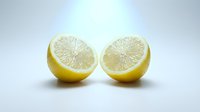 Fresh lemon halves cut in half showing juicy citrus flesh and seeds on clean white background for cooking and healthy nutrition concepts.