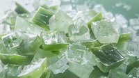 Fresh aloe vera plant cubes with ice crystals, close up macro shot showing transparent gel texture and cooling effect for skincare and cosmetic products.
