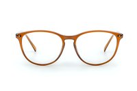 Brown round eyeglasses frame with transparent lenses isolated on white background. Modern optical accessory for vision correction and style.