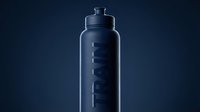 Sleek dark blue spray bottle with minimalist branding on isolated background, suitable for cosmetics, skincare, or household product packaging mockups and design templates.