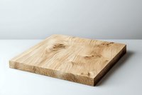 Natural oak wooden cutting board with distinctive grain pattern on white background, minimalist kitchen accessory for food preparation and serving.
