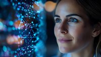 Young woman with gentle smile illuminated by blue digital network visualization, representing technology, artificial intelligence and future innovation concepts.