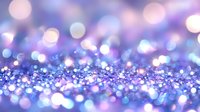Dreamy purple and blue glitter background with soft bokeh effect creates magical atmosphere for festive designs and celebration themes.