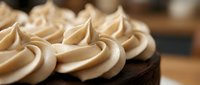 Piped meringue peaks on chocolate cake, showcasing bakery confectionery artistry and dessert decoration techniques for culinary and food styling projects.
