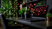 Laptop with glowing red heart symbols on screen in dark home office setting with houseplants and ambient lighting, creating romantic atmosphere.