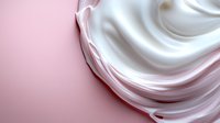 Smooth white cream swirls on pink background with soft texture and gentle curves creating luxurious cosmetic product presentation for beauty and skincare advertising.