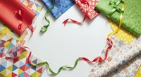 Colorful wrapped gift boxes with ribbons and patterned paper arranged on white background, ideal for holiday, birthday, celebration, and festive design projects.