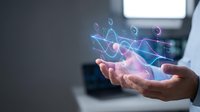 Businessman holding glowing digital wave data visualization with holographic graphs and analytics interface for technology, business intelligence, and financial analysis concepts.
