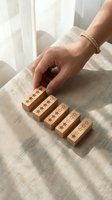 Woman hand placing wooden blocks with five star rating symbols on linen fabric surface for customer feedback and quality assessment concepts.