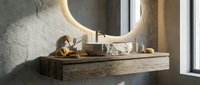 Modern bathroom vanity with floating wooden cabinet, round mirror, and natural stone sink in minimalist spa-like interior design for luxury home renovation.