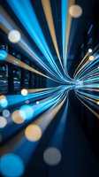 Abstract blue light trails creating dynamic motion blur effect with glowing streaks radiating from center point against dark background for technology concepts.