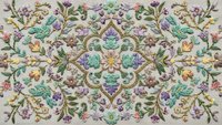 Ornate floral embroidery pattern with colorful blooms and decorative scrollwork on fabric background, perfect for textile design and crafting projects.