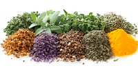 Colorful aromatic spices and dried herbs arranged in decorative piles including turmeric, cloves, sage leaves, thyme, and oregano on white background, isolated.