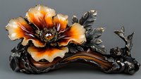 Decorative bronze sculpture featuring orange-tinted flower with metallic petals and dark patina leaves on curved base. Artistic home decor piece with antique finish.