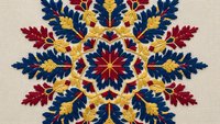 Ornate folk art mandala with blue and red leaves, golden accents on beige background. Traditional decorative pattern for textile and craft projects.