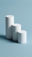 Three white cylindrical podiums arranged in ascending height order on soft blue background for product display and presentation purposes.