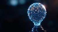 Glowing light bulb formed by connected dots and lines representing digital transformation and innovation network on dark background.