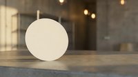 Blank white round card mockup on wooden table with warm bokeh lights background for branding design presentation and marketing materials display.