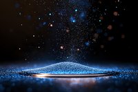Magical glowing particles forming wave shape with blue sparkles and bokeh effect against dark background, creating ethereal cosmic atmosphere.
