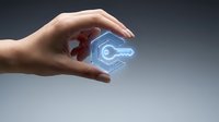Hand protecting glowing digital key icon representing cybersecurity, data protection and secure access technology for business solutions.