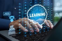 Professional hands typing on laptop with glowing learning interface and digital technology icons for online education and skill development concepts.