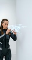 Young woman with braided hair, wearing black futuristic suit, holding holographic vehicle blueprint projection in hands against white background for technology and innovation concepts.