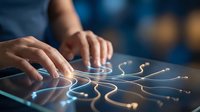 Hands of a person interacting with glowing digital circuit pathways on a touchscreen surface, representing technology, innovation, and digital connectivity for business solutions.
