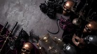 Dark elegant masquerade party setup with ornate masks, candles, wine bottles and decorative elements on textured surface for luxury event planning.