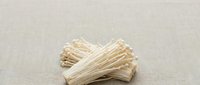 Dried straw or hay bundle isolated on neutral beige background, ready for design projects, crafts, agriculture themes, and rustic decorative applications.