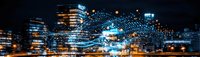 Abstract digital network visualization over blurred urban night cityscape panorama with glowing blue light trails and illuminated buildings creating futuristic technology concept.