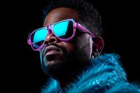 African American man wearing neon purple sunglasses and blue fur coat against dark background, illuminated by vibrant cyan lighting creating modern fashion portrait.