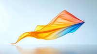 Flowing colorful fabric in motion with orange, yellow and blue gradient colors against light background, creating dynamic wave-like shapes and folds.