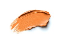 Orange cosmetic cream smear isolated on white background, textured makeup foundation stroke showing product consistency and color pigment for beauty industry.