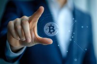 Businessman touching virtual cryptocurrency symbol with finger, digital finance concept for blockchain technology and digital wallet applications.