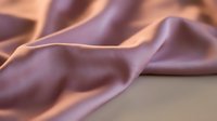 Luxurious purple silk fabric with elegant flowing folds and soft draping texture for fashion design and textile projects.